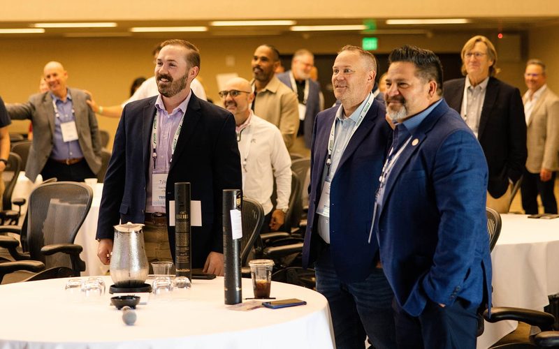 AT&T and fellow attendees standing during an interactive session