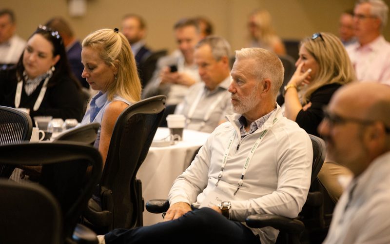 A full session room of telecom credit and risk professionals